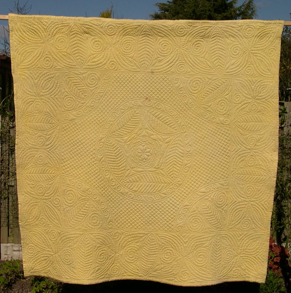 Pale yellow wholecloth quilt