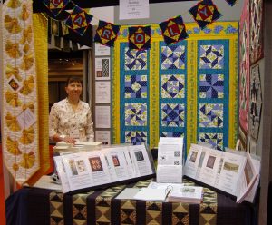 Carolyn Gibbs stand at the Festival of Quilts