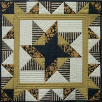 Black and gold patchwork quilt