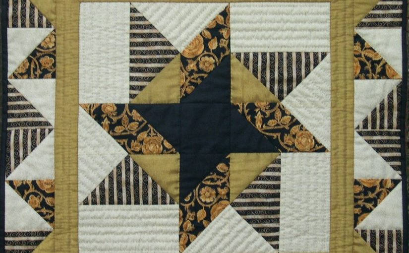 Black and gold patchwork quilt