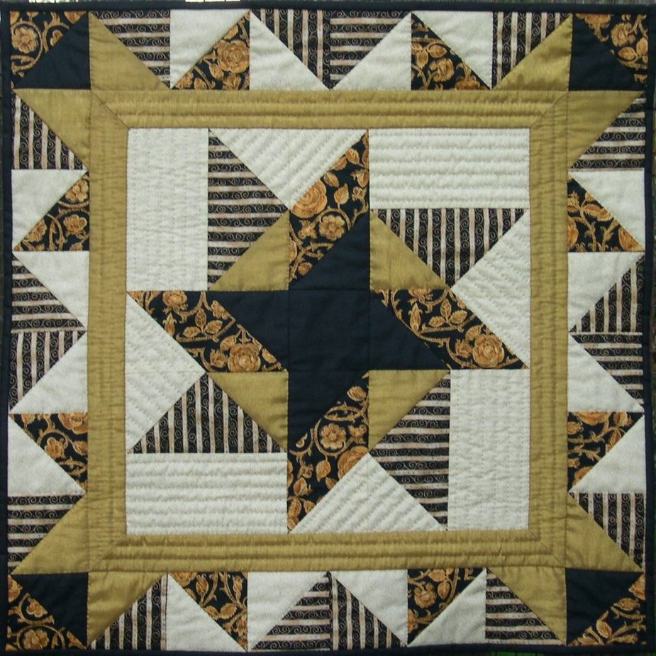 Black and gold patchwork quilt