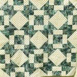 Green and cream quilt