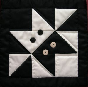 Patchwork showing two stylised cats