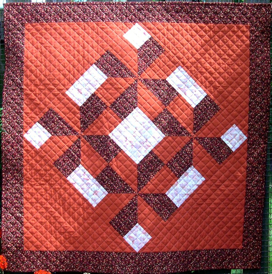 Terracotta, cream and mulberry patchwork