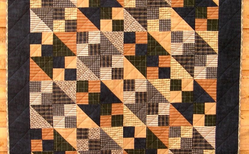 Brown, black and grey small quilt using the Northerrn Lights block