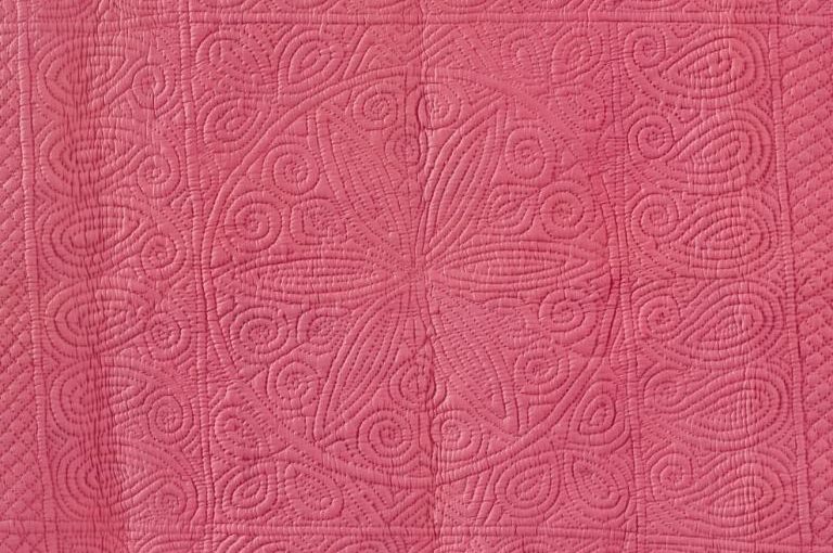 Deep pink wholecloth quilt