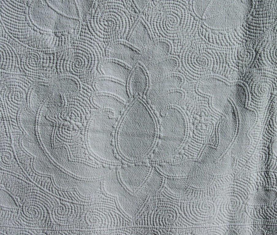 Pineapple motif stitched in white on white