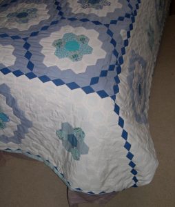 Blue diamonds down corner of quilt