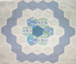 Blue and white hexagons arranged in a circular pattern