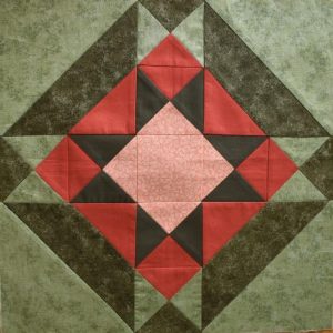 Soft green and terracotta patchwork star block