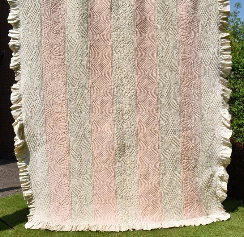 Alternating strips of hand-quilted fabric