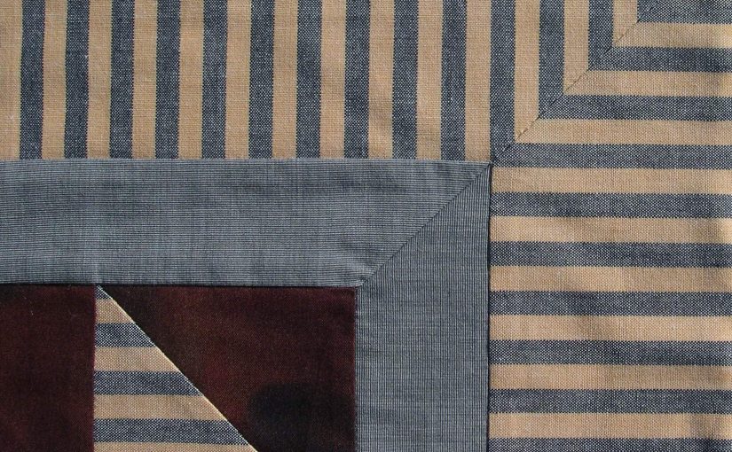 Striped fabrics meet perfectly in border corner