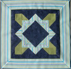 Blue, lime green and tut=rquoise block with striped border