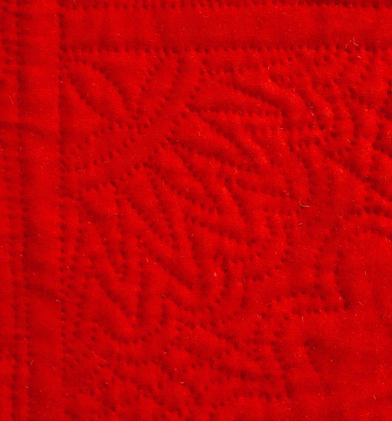 Red wool quilt with spiky motif