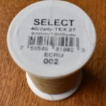 Reel of YLI Select thread in Ecru