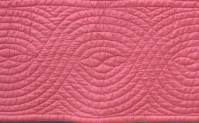 Pink quilt border with cable design