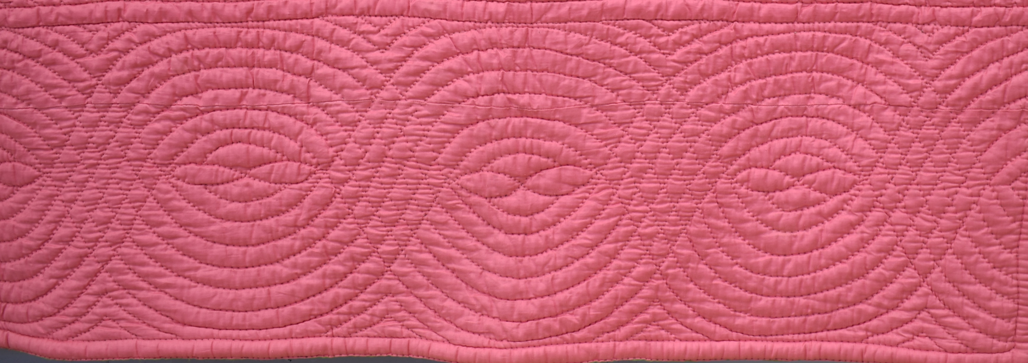 Pink quilt border with cable design