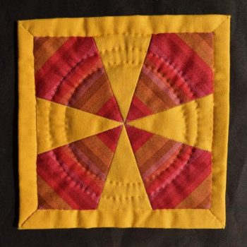 Red and yellow patchwork mat