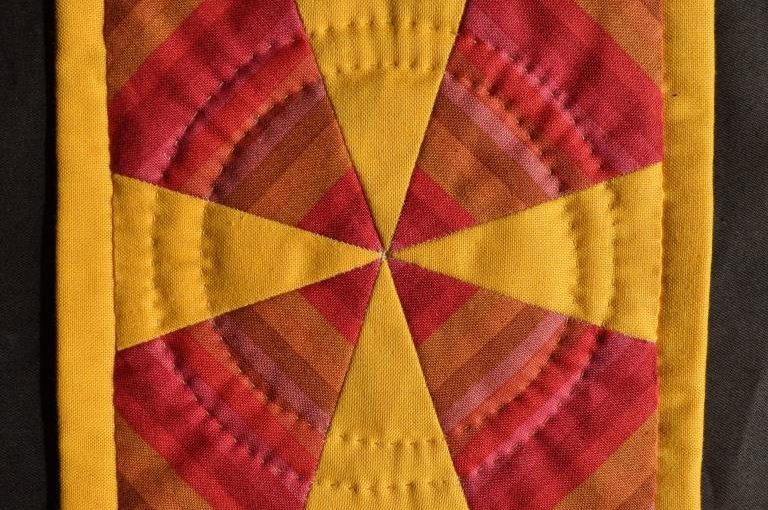 Red and yellow patchwork mat