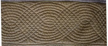 Yellow quilt border with cable design