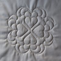White quilted hearts design with deep texture