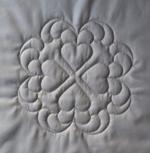 White quilted hearts design with deep texture
