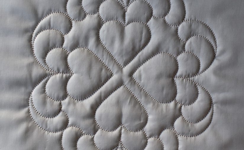 White quilted hearts design with deep texture