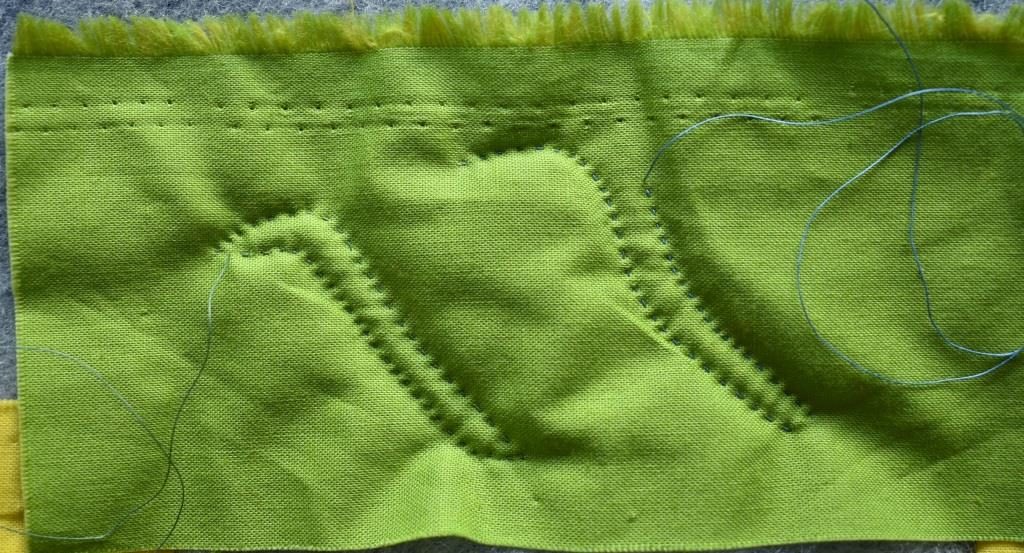 Sample stitched with green thread and blue thread for comparison