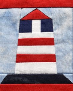 Red, white and blue pieced lighthouse