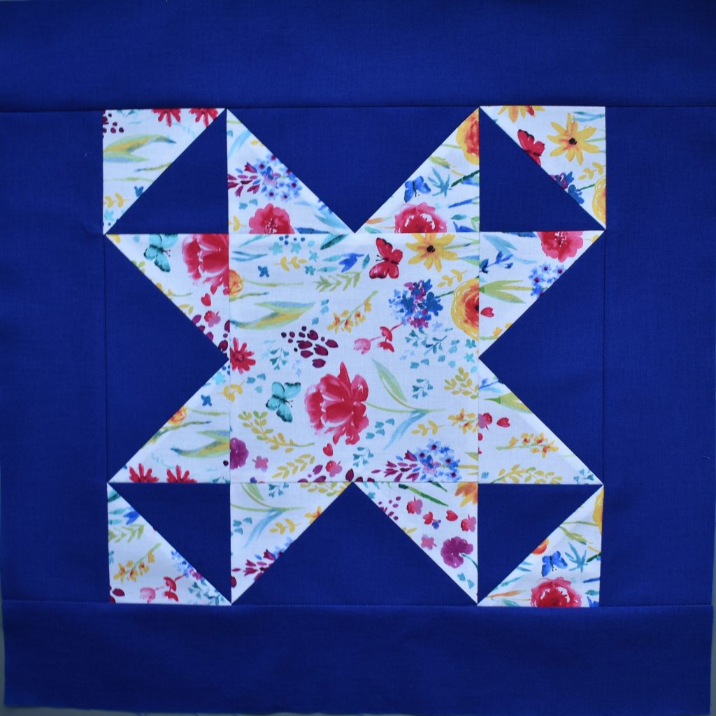 White patterned patchwork star on blue bakground