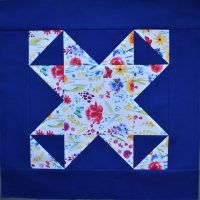 White patterned patchwork star on blue bakground
