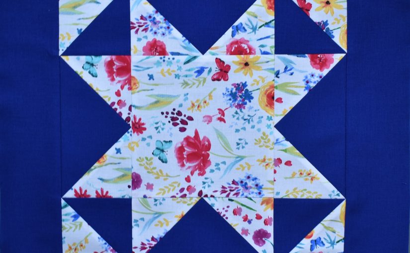 White patterned patchwork star on blue bakground