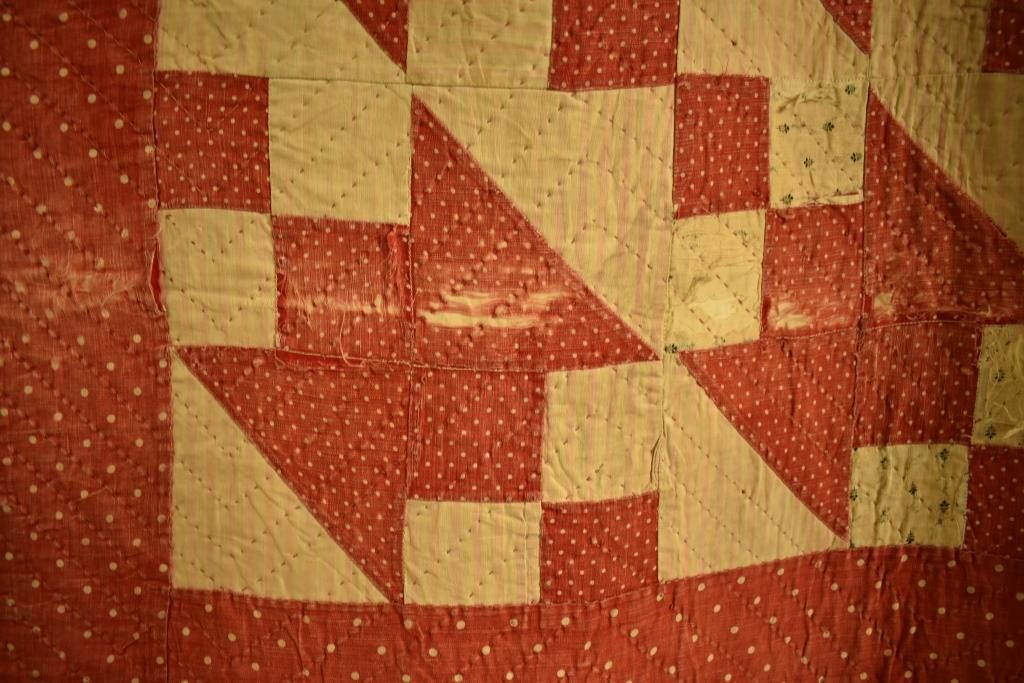 Red and cream patchwork with zig-zag quilting