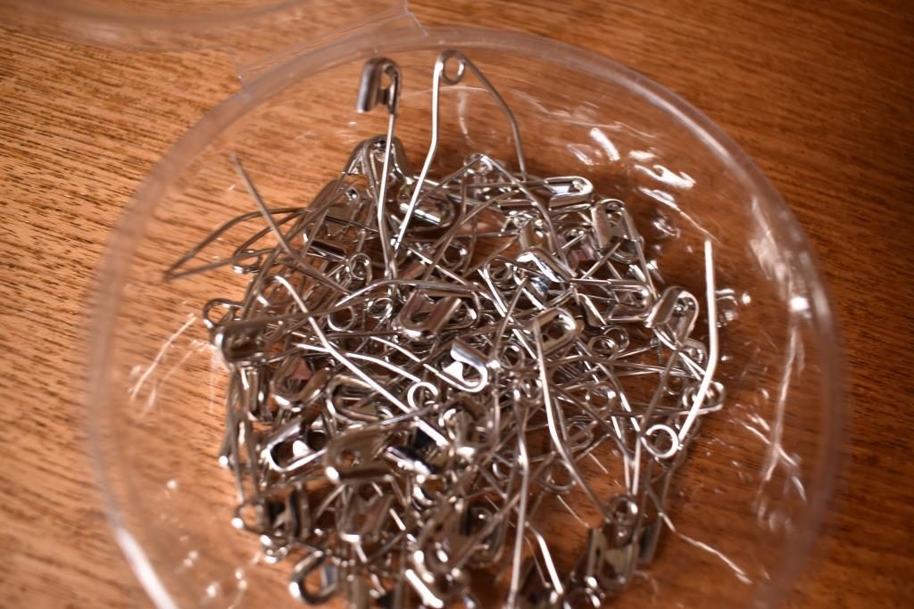 Pile of open safety pins
