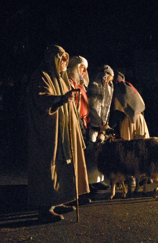 Elderly man standing, dressed as shepherd