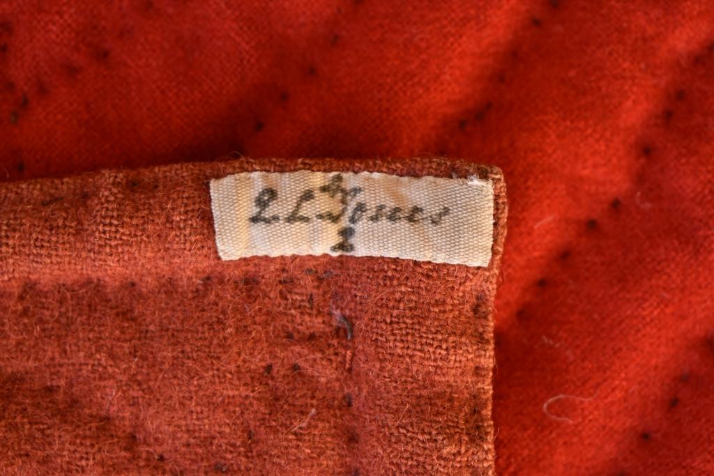 Cloth label with Q. L. Jones written in cursive script