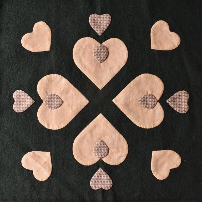 Cream hearts design on dark green background