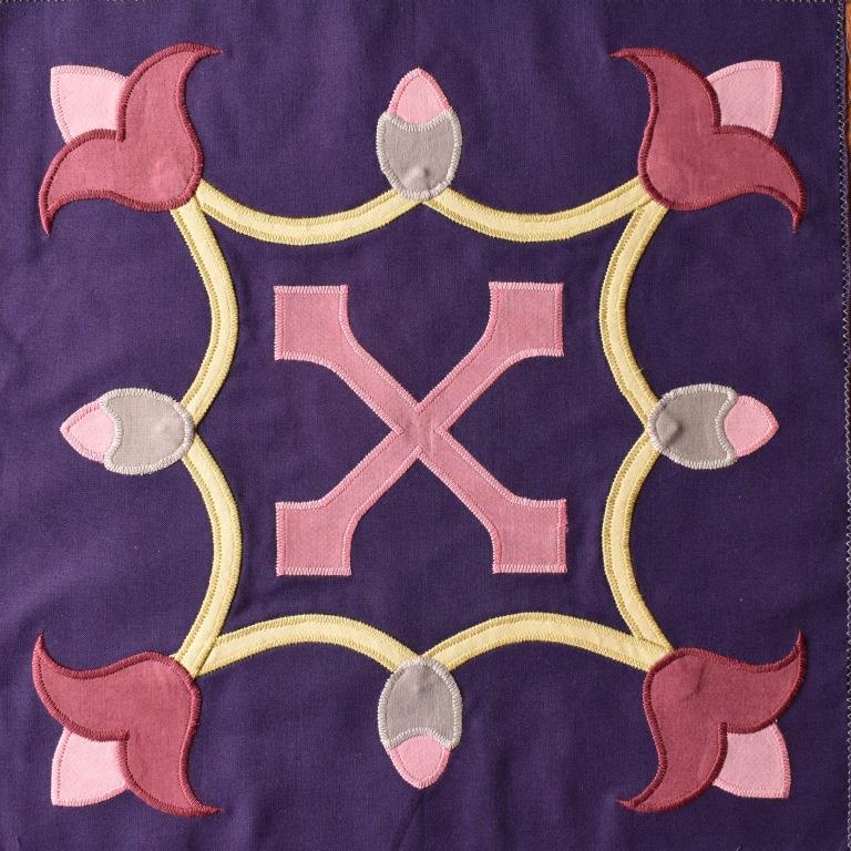 Pink Lily motifs set into a quatrefoil, on dark purple background