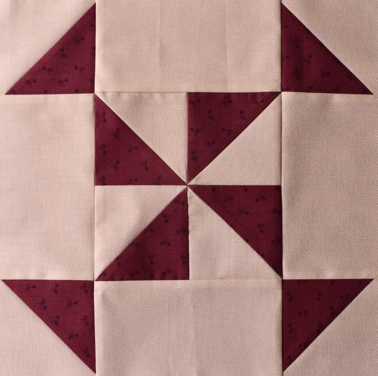 Dark red star on pink patchwork