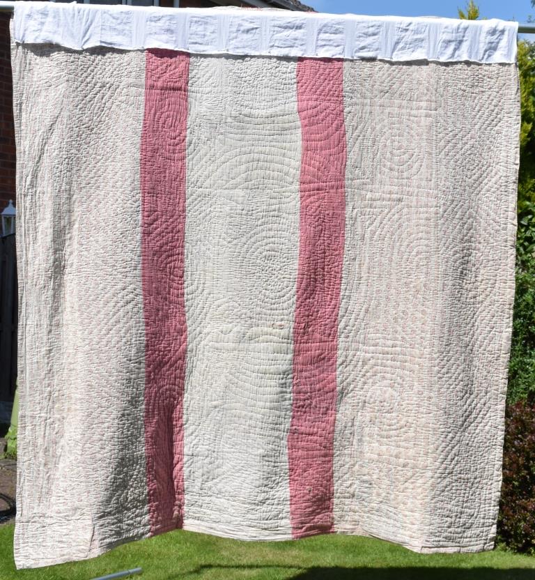 Pink and white quilt