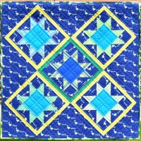 Patchwork stars on blue background