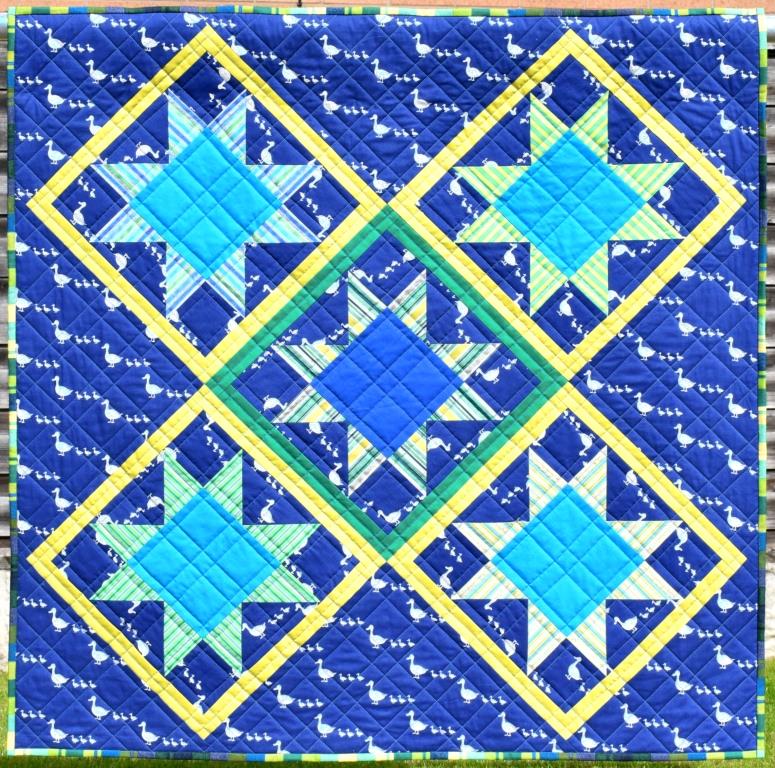 Patchwork stars on blue background