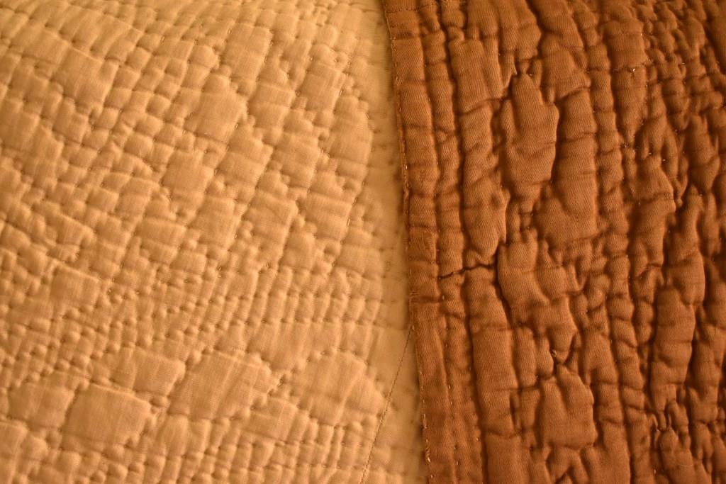 Two different coloured fabrics, brown & cream